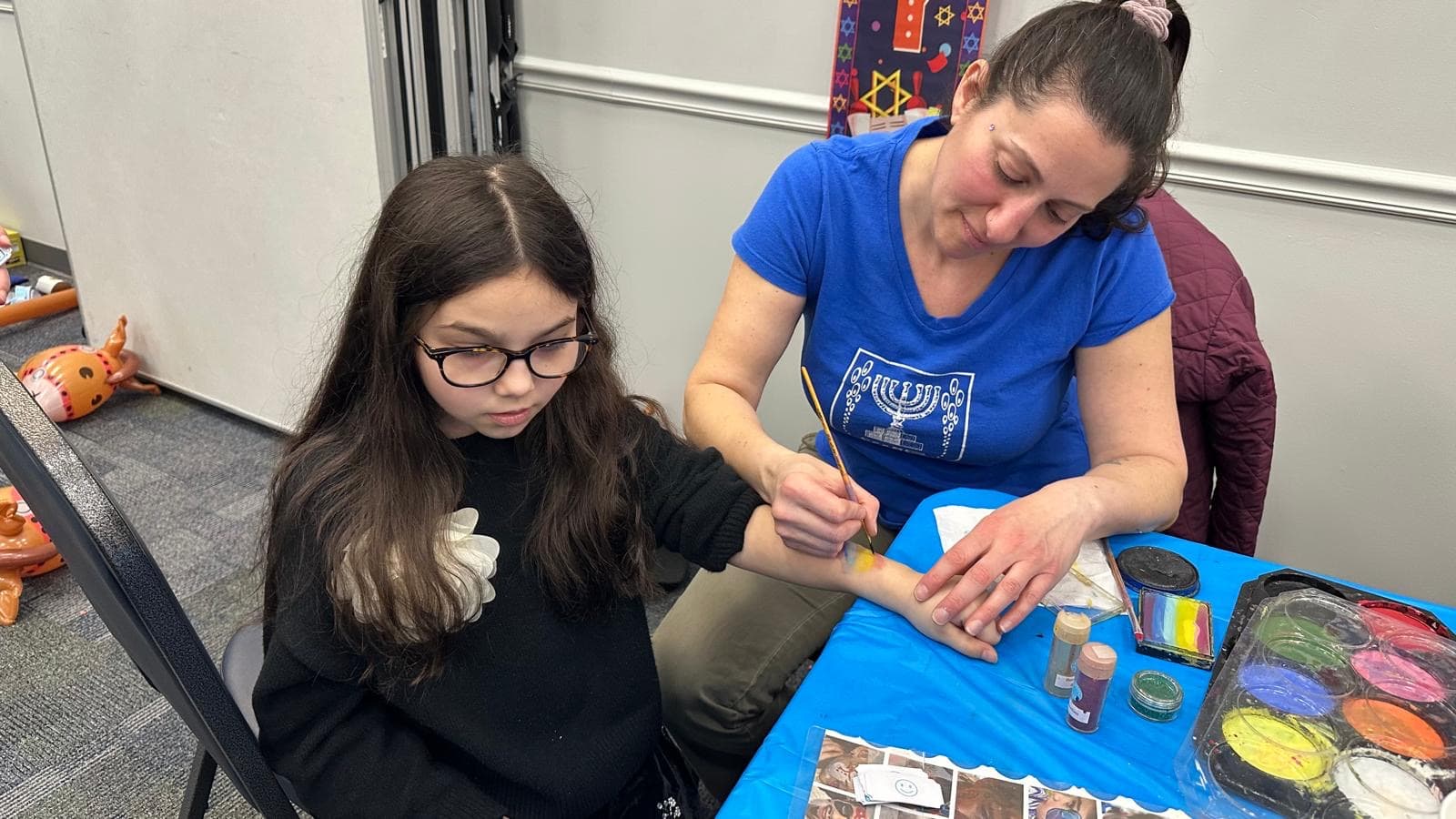 Face painting fun at the Purim celebration