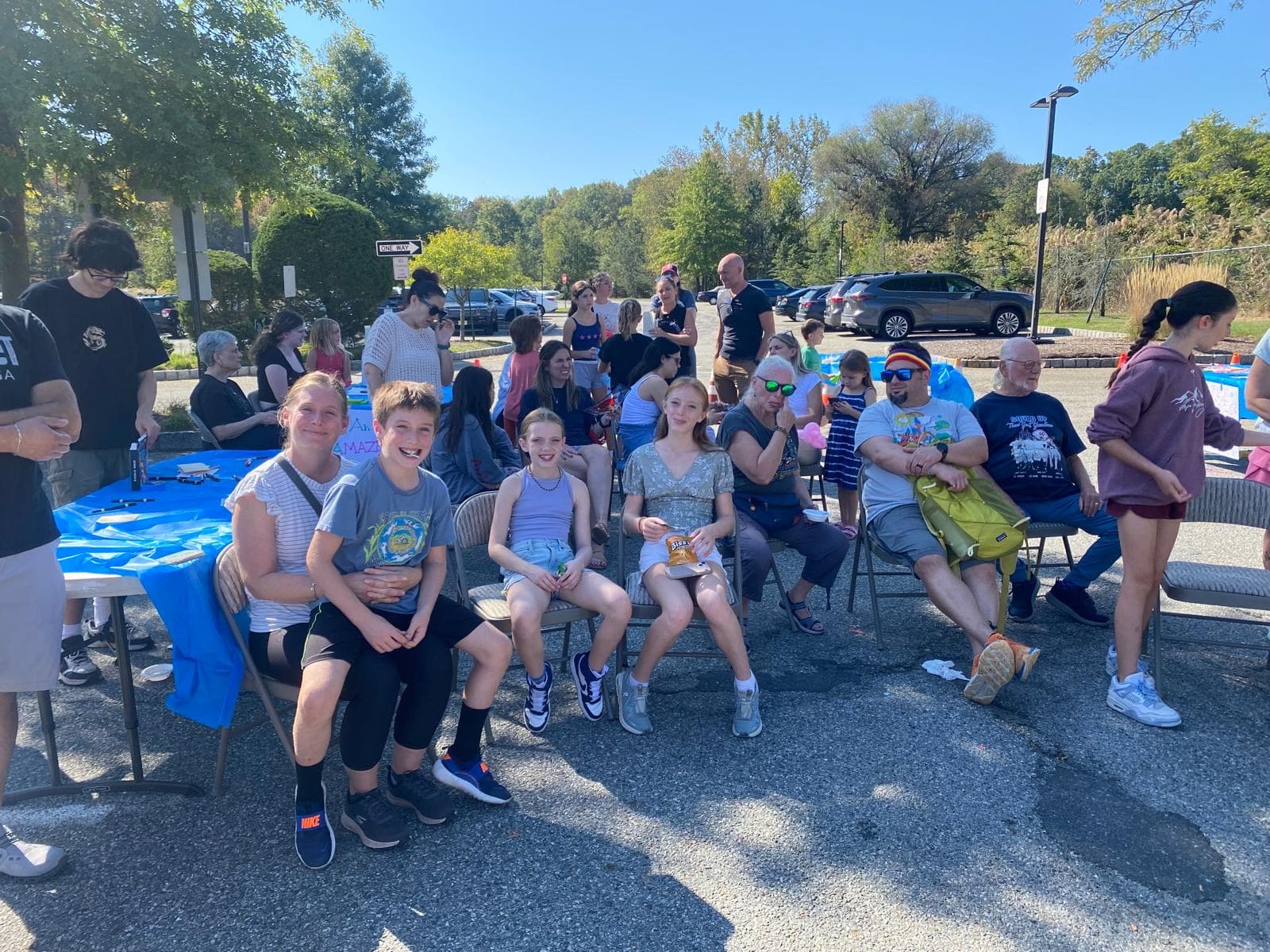Families and friends gathered outdoors for a community celebration