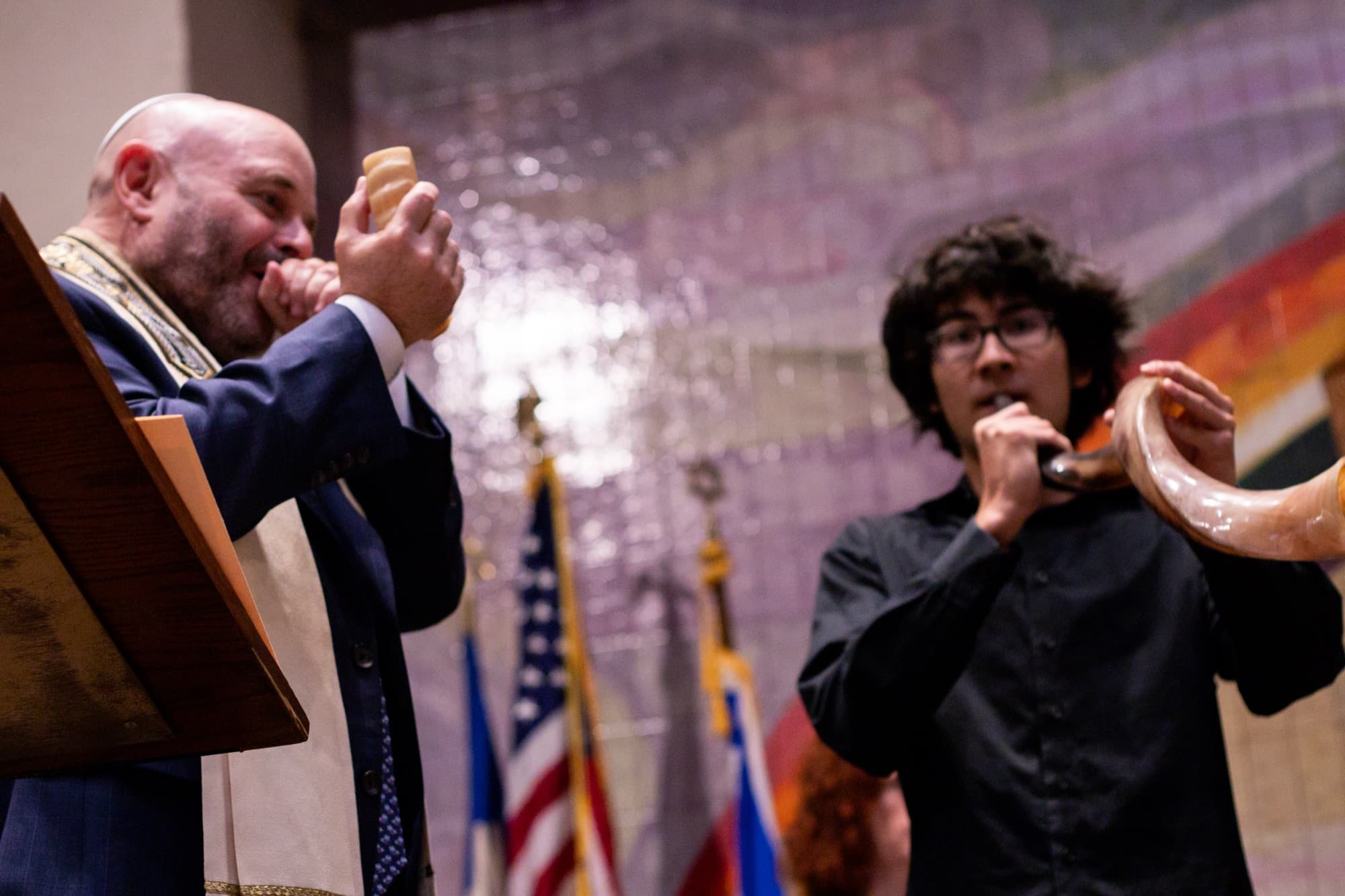 Rabbi Doug and a musician blow shofars together during High Holiday services