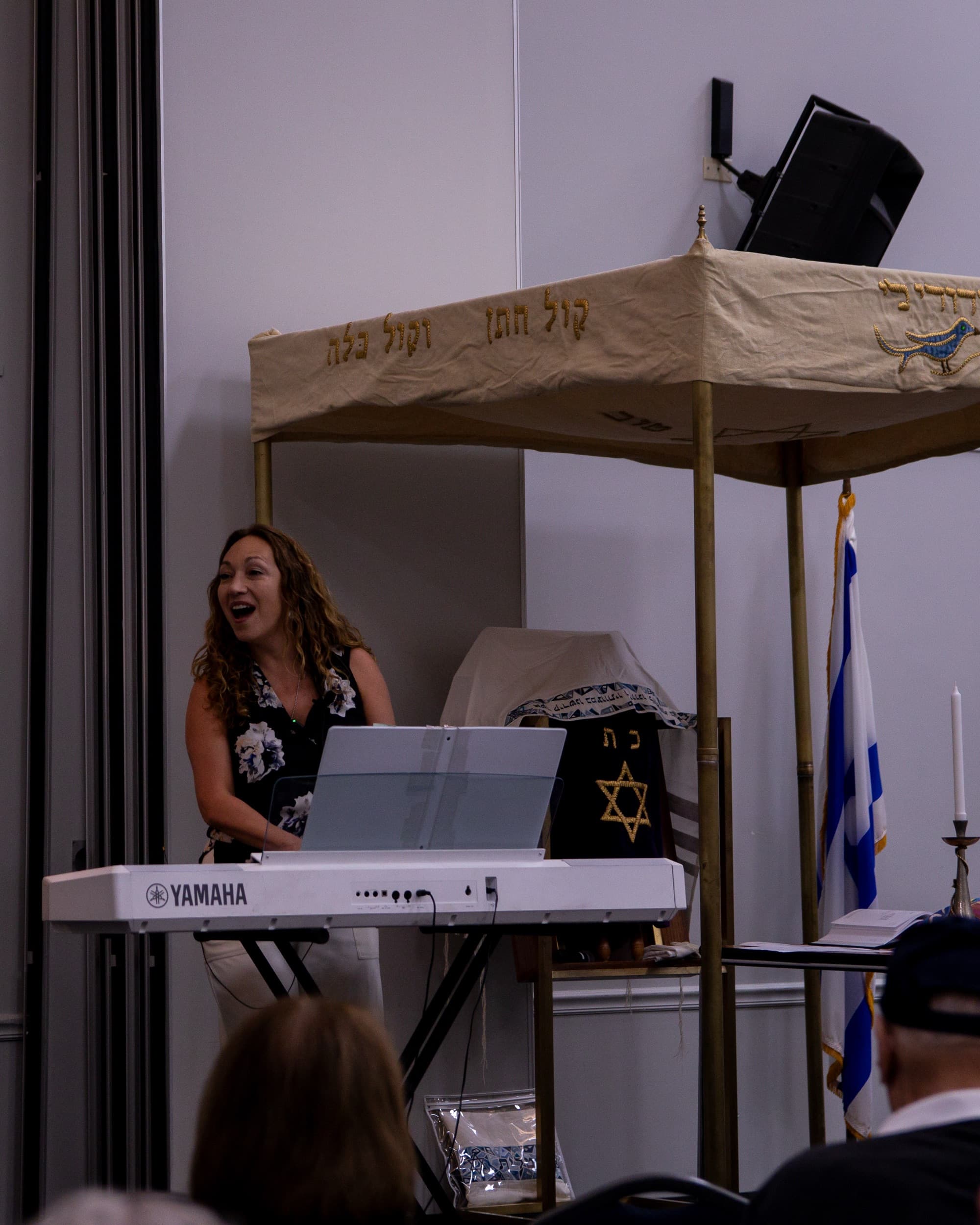 Cantor Anna Zhar singing joyfully during a service