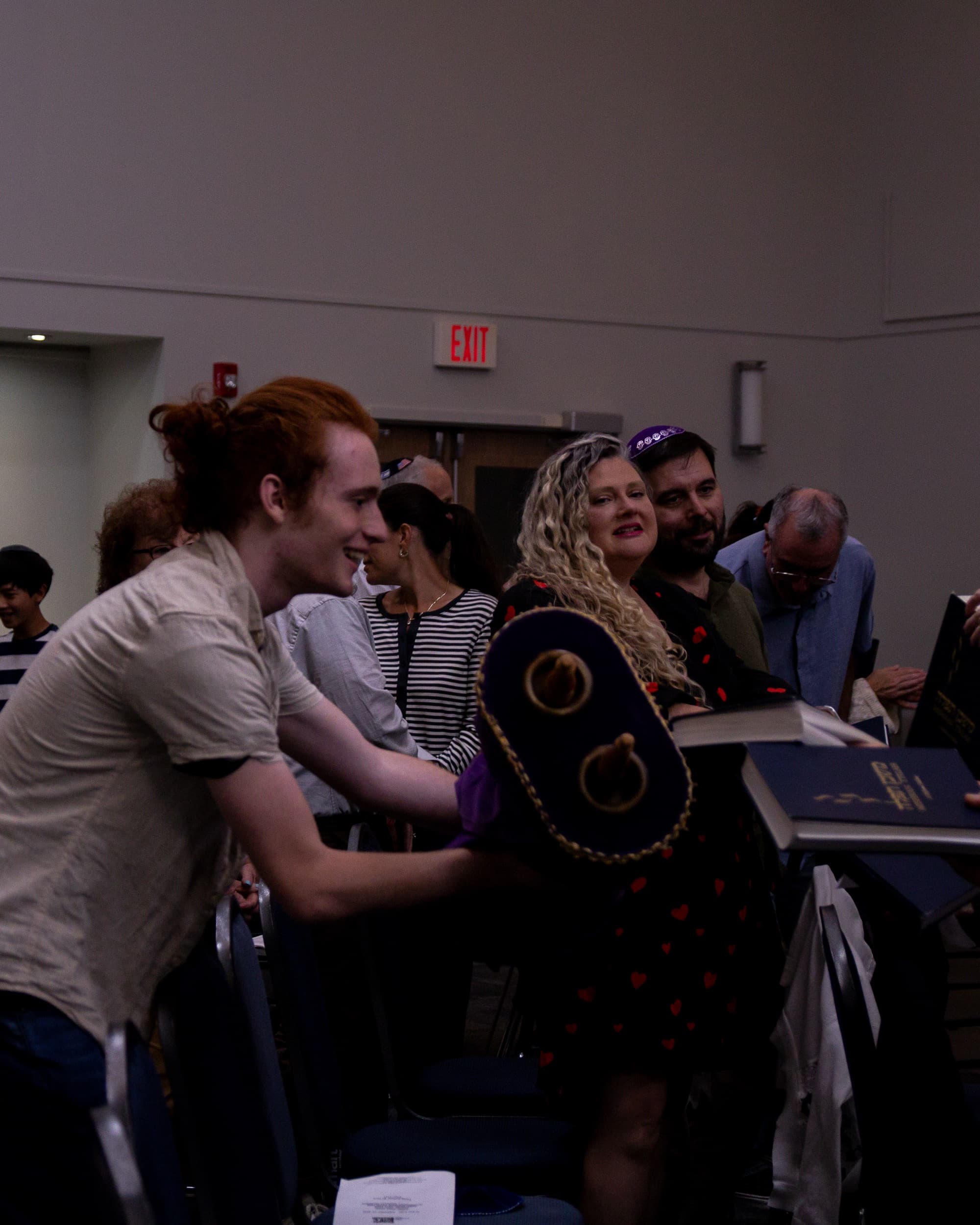 Community members sharing Torah during Shabbat services